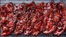 mediterranean-style pomegranate-glazed pork belly strips