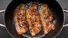 mediterranean-style pomegranate-glazed pork belly strips