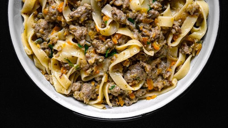 white & creamy soffritto & sausage meat ragù sauce with tagliatelle